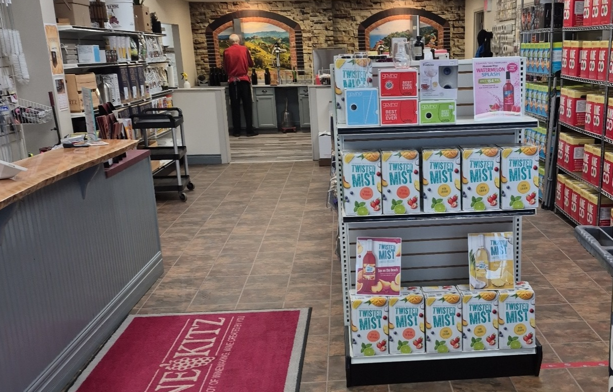 Wine Kitz Quispamsis interior showing wine kits and Tuscan mural